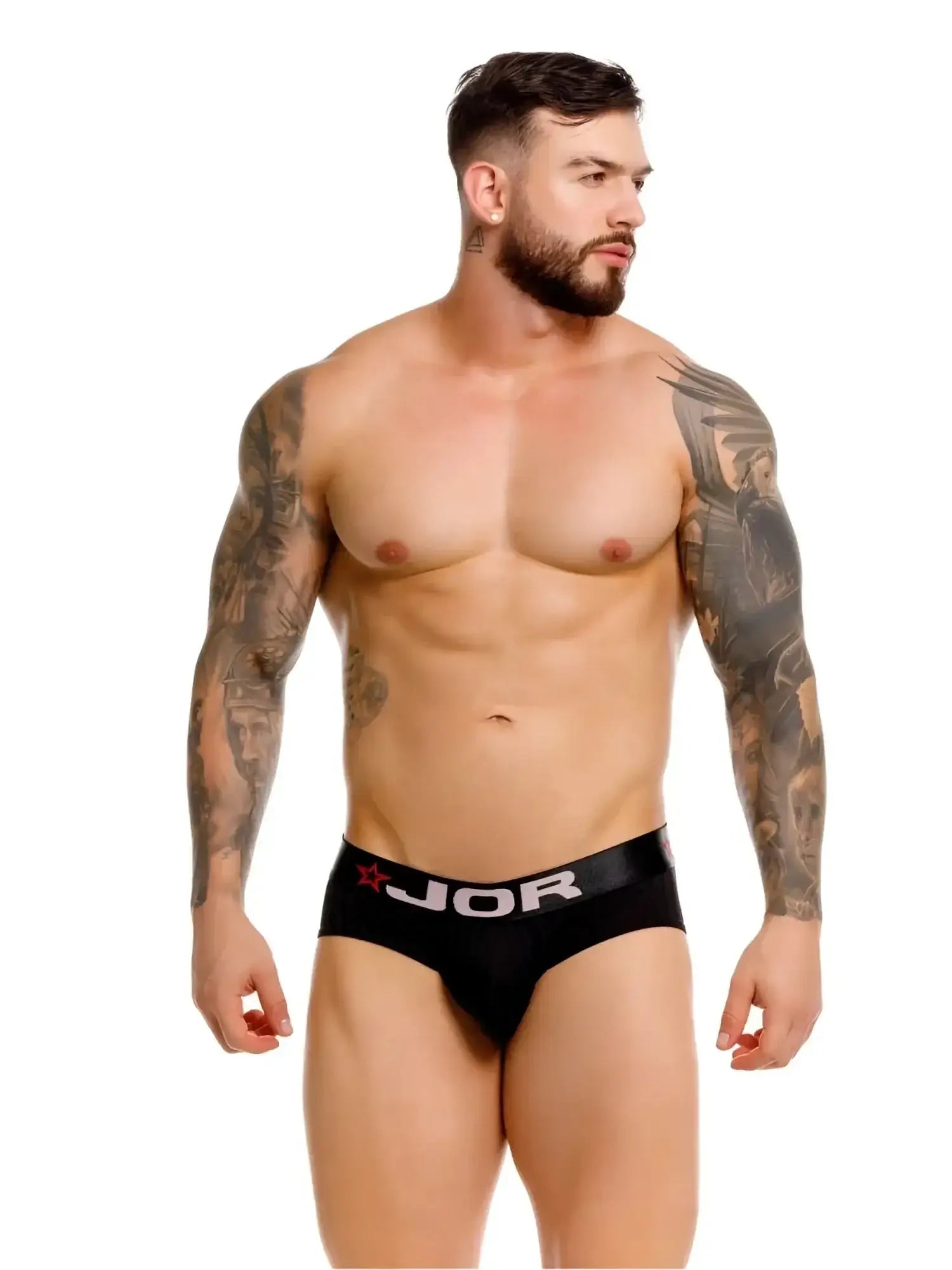 Front view of a model wearing black JOR 2331 Cronos briefs with logo waistband.