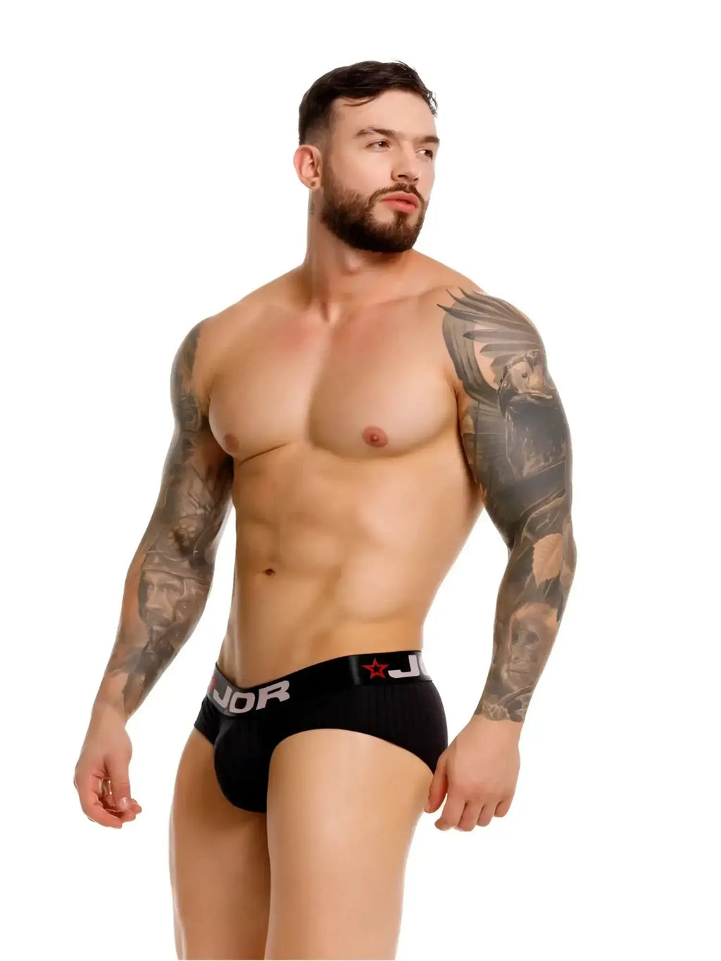 Front view of a model wearing black JOR 2331 Cronos briefs with a branded waistband.
