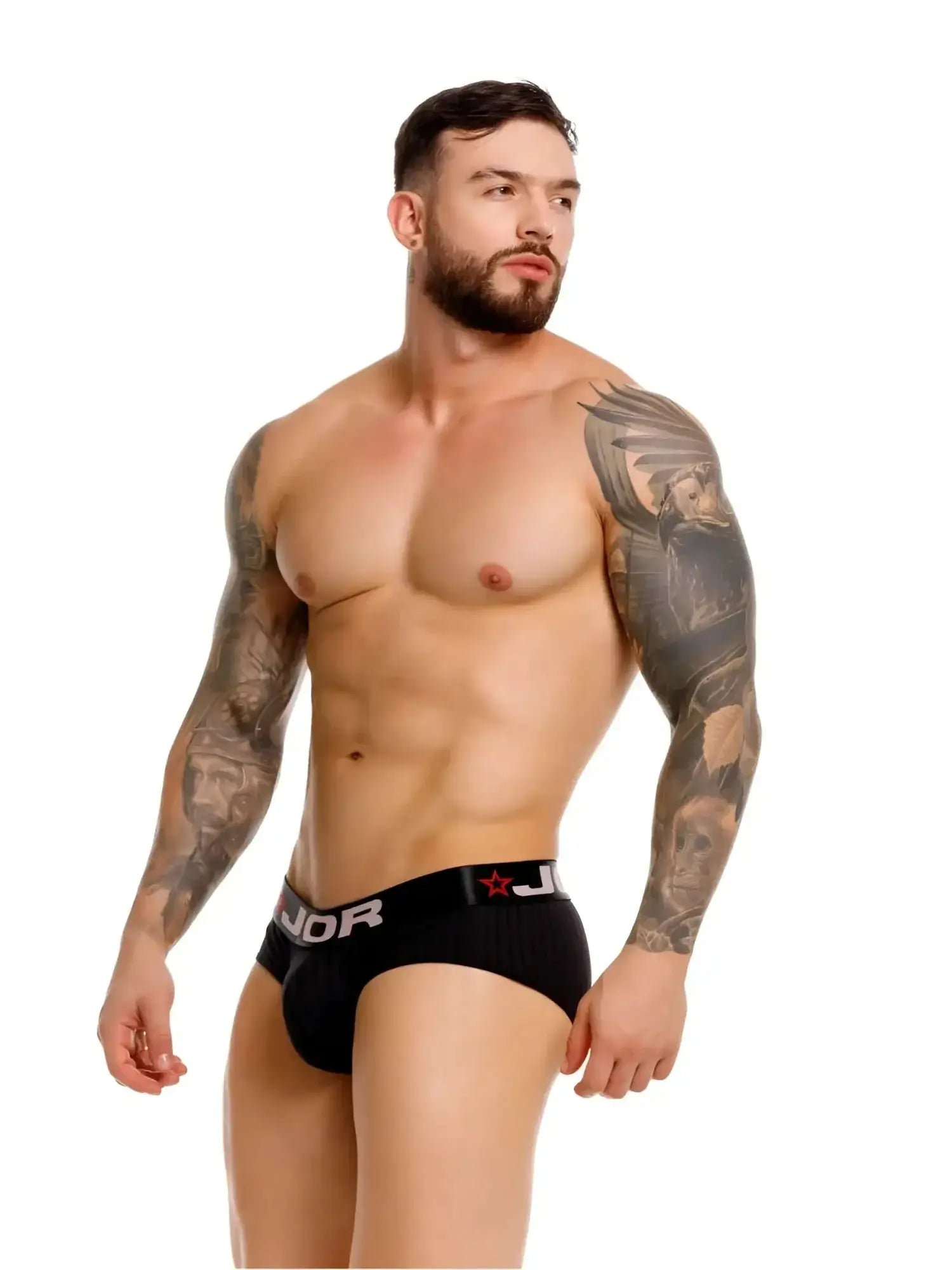 Front view of a model wearing black JOR 2331 Cronos briefs with a branded waistband.
