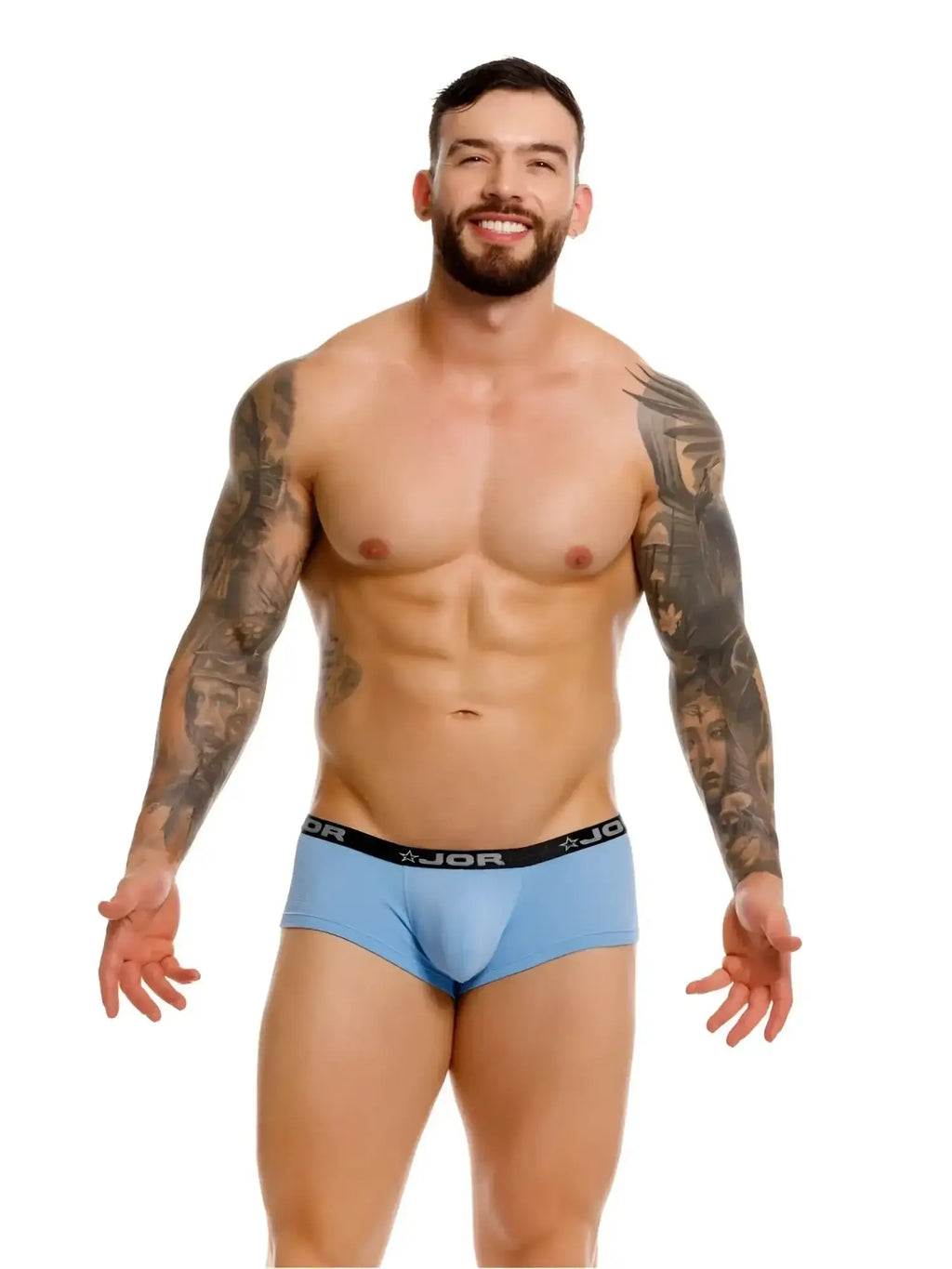 Front view of a model wearing JOR 2345 Cannes blue trunks.