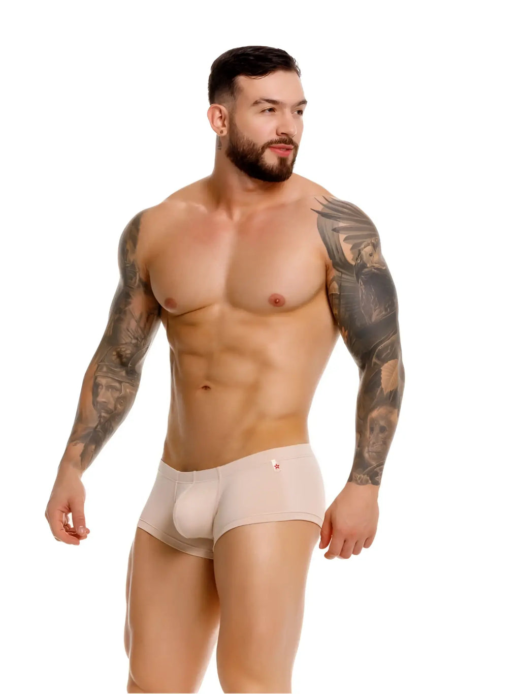 Model wearing beige JOR 2347 Invisible Trunks, front-side view, isolated on a white background.