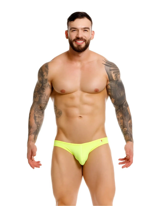 Front view of a model wearing JOR 2354 Origin thongs in neon green.