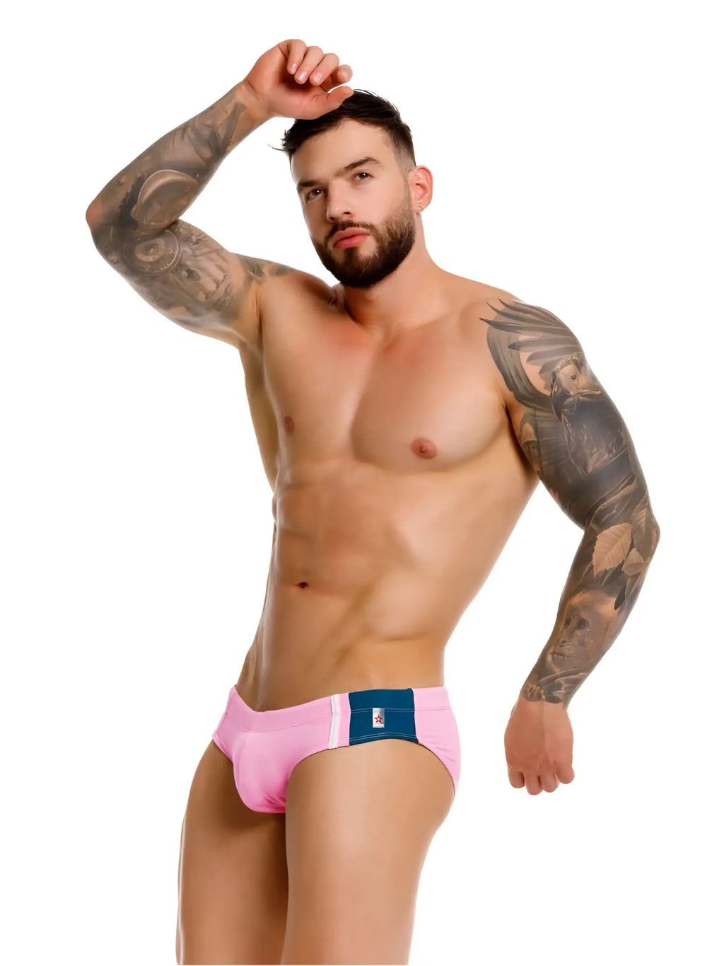 Front view of JOR 2384 Wind swim briefs in pink worn by a tattooed model.