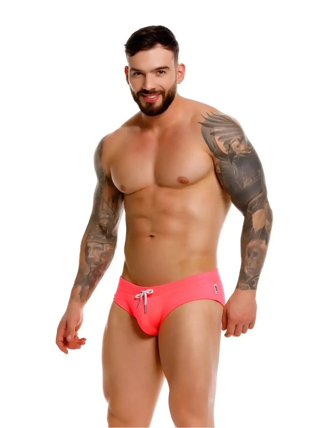 Front view of a man wearing JOR 2387 Travel Swim Briefs in Candy pink.