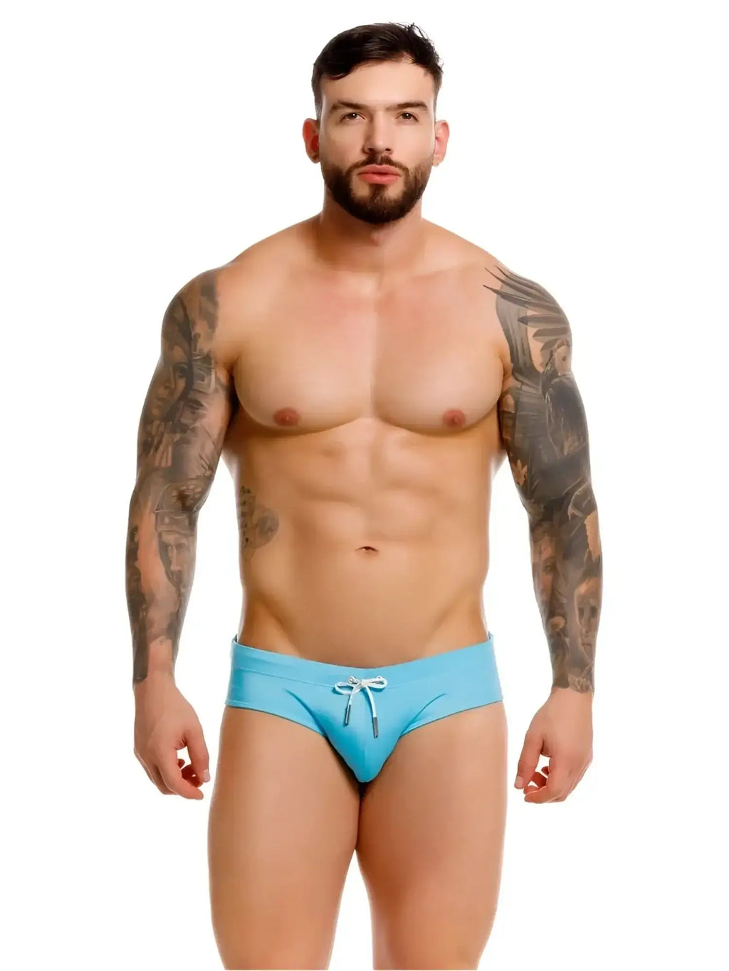 Front view of a man wearing JOR 2387 Travel swim briefs in turquoise.