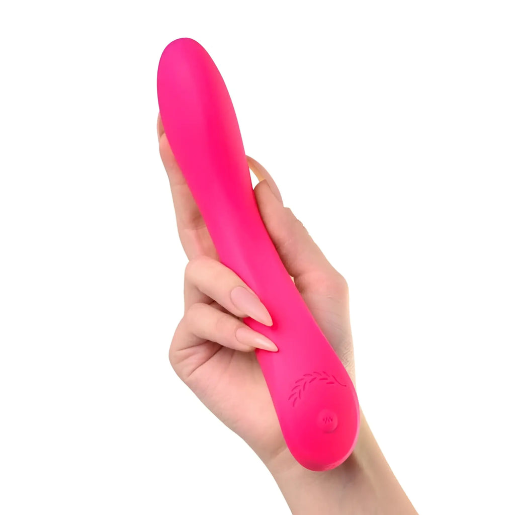 A vibrant pink sleekly curved silicone vibrator with engraved leaf pattern near the base jos jos twig slimline vibrator