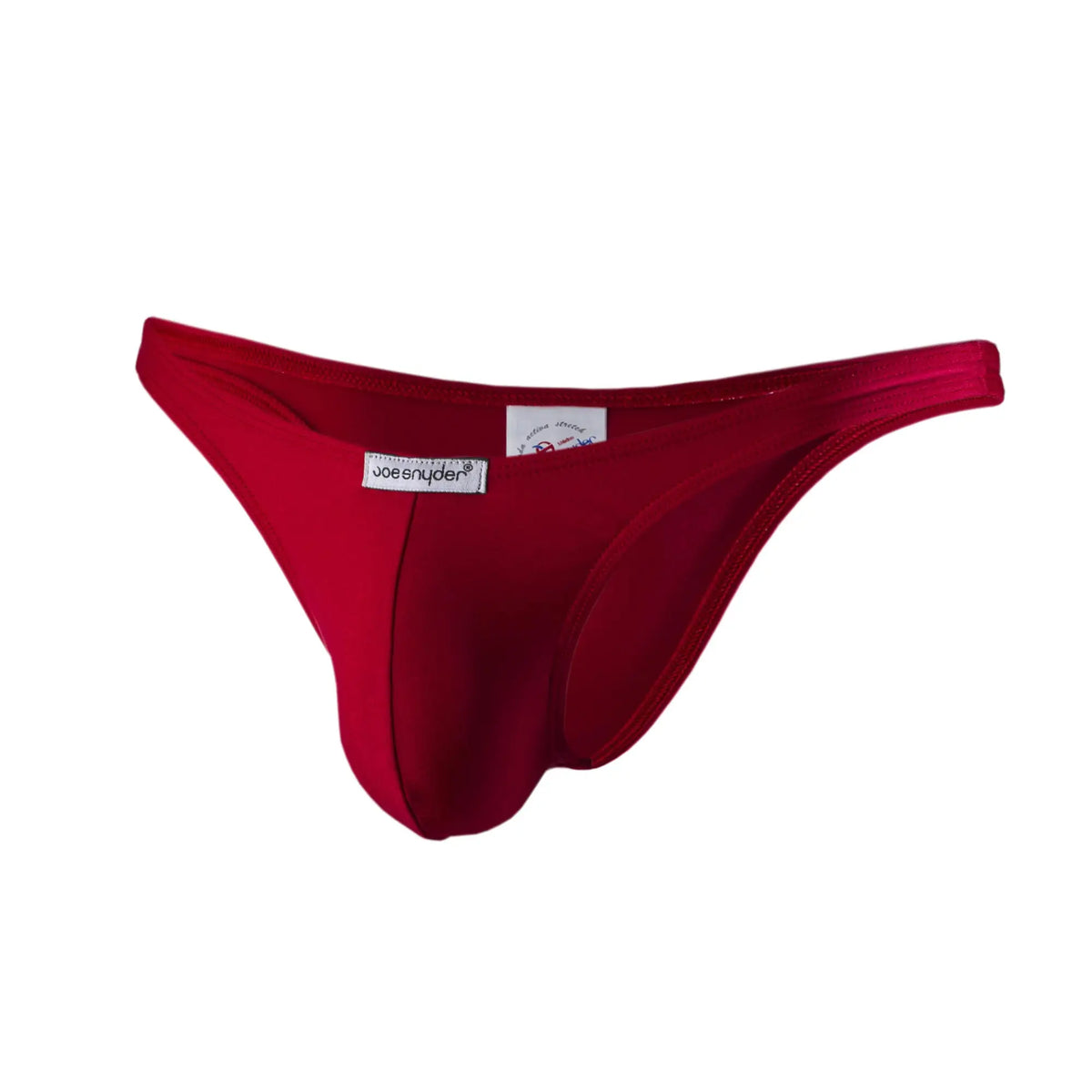 A vibrant red joe snyder polyester capri thong made of smooth stretchy fabric with a branded label visible