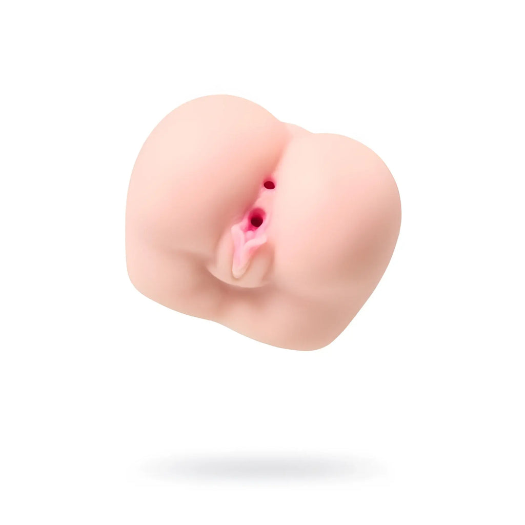 Pink silicone anal plug with realistic texture and subtle red detailing from juicy juicy butt masturbator paula