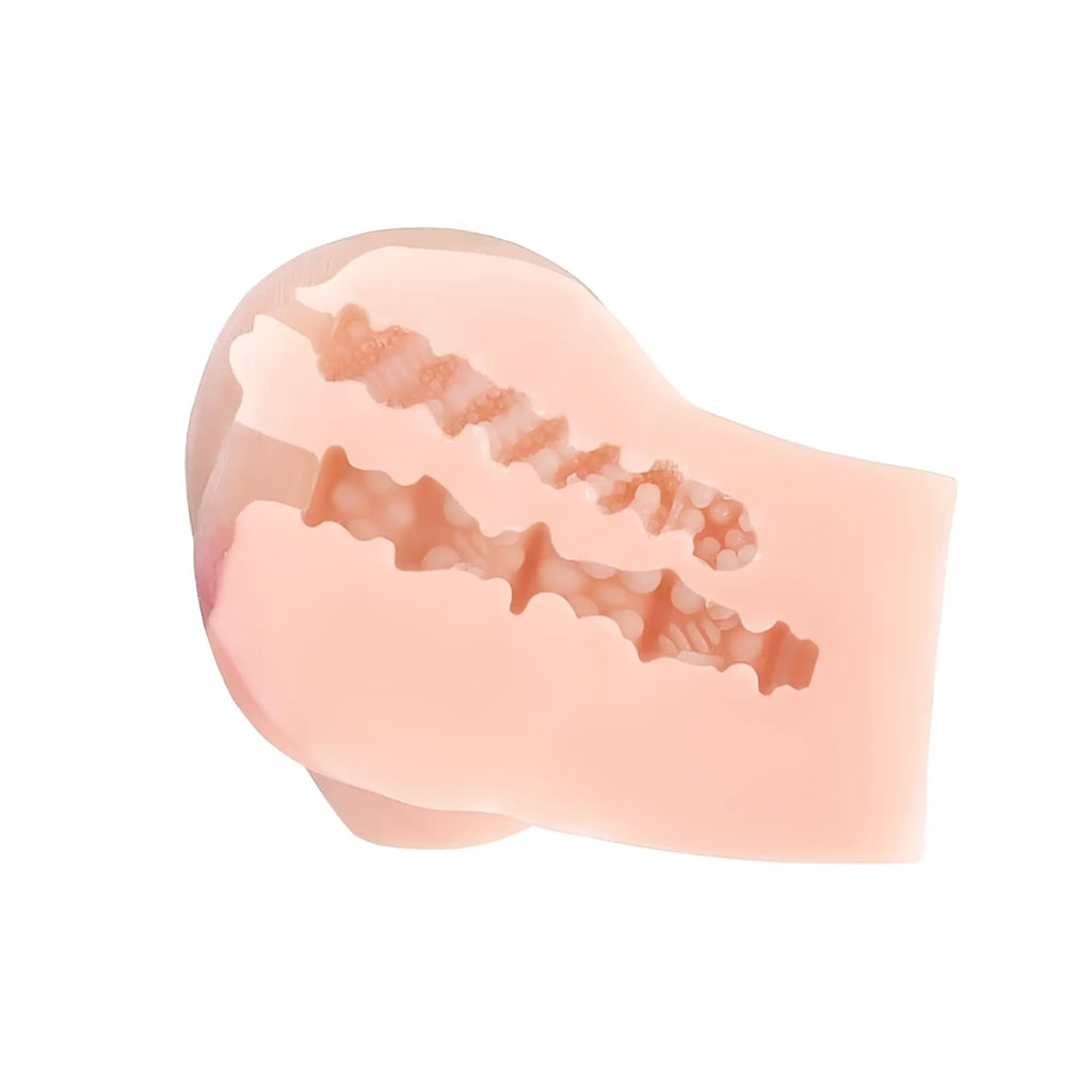 Pink silicone anal plug with textured ridges and tapered design from juicy juicy pussy masturbator adele