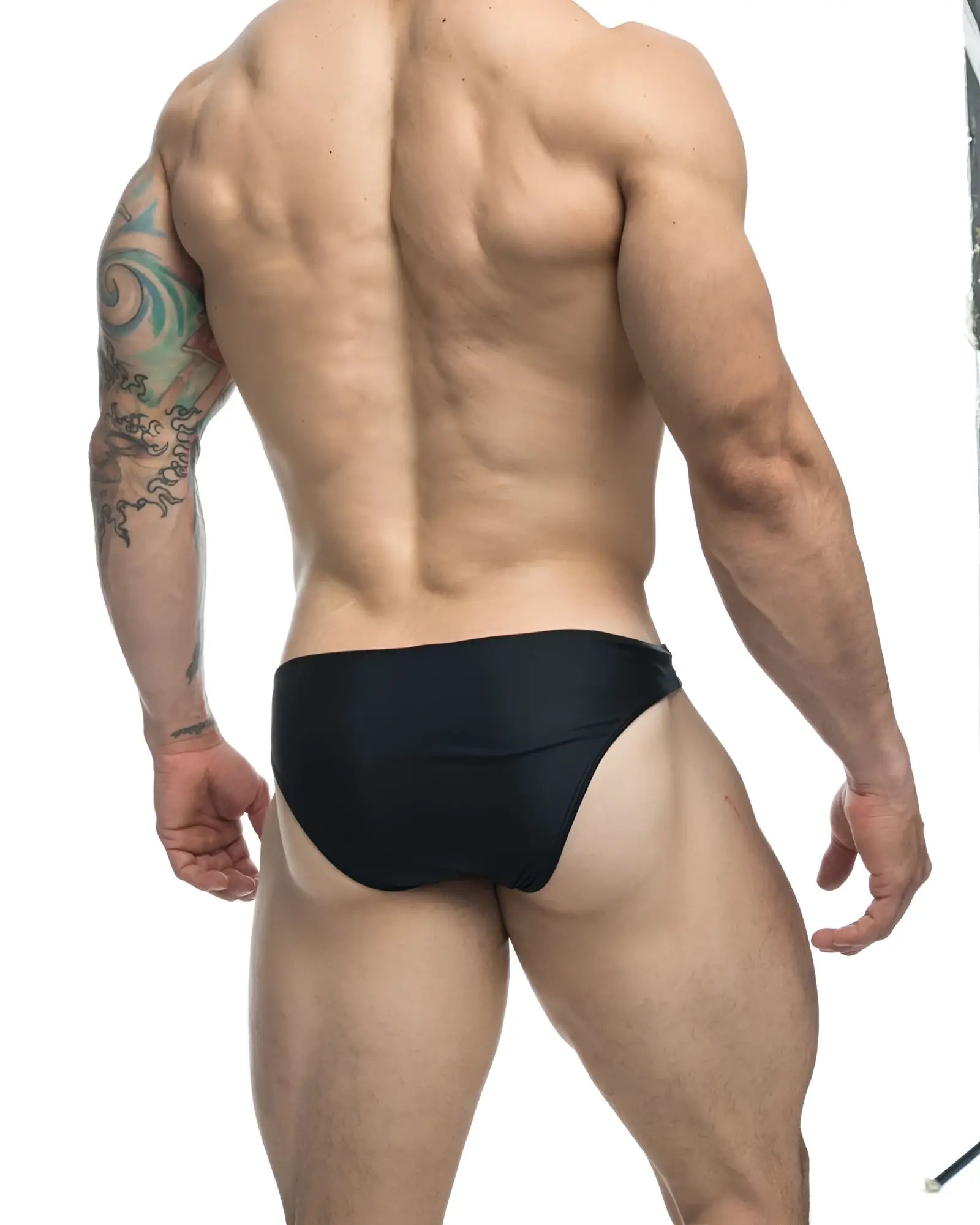 Black justin simon xsj01 classic bikini swim trunks with a form-fitting design ideal for swimming and beachwear