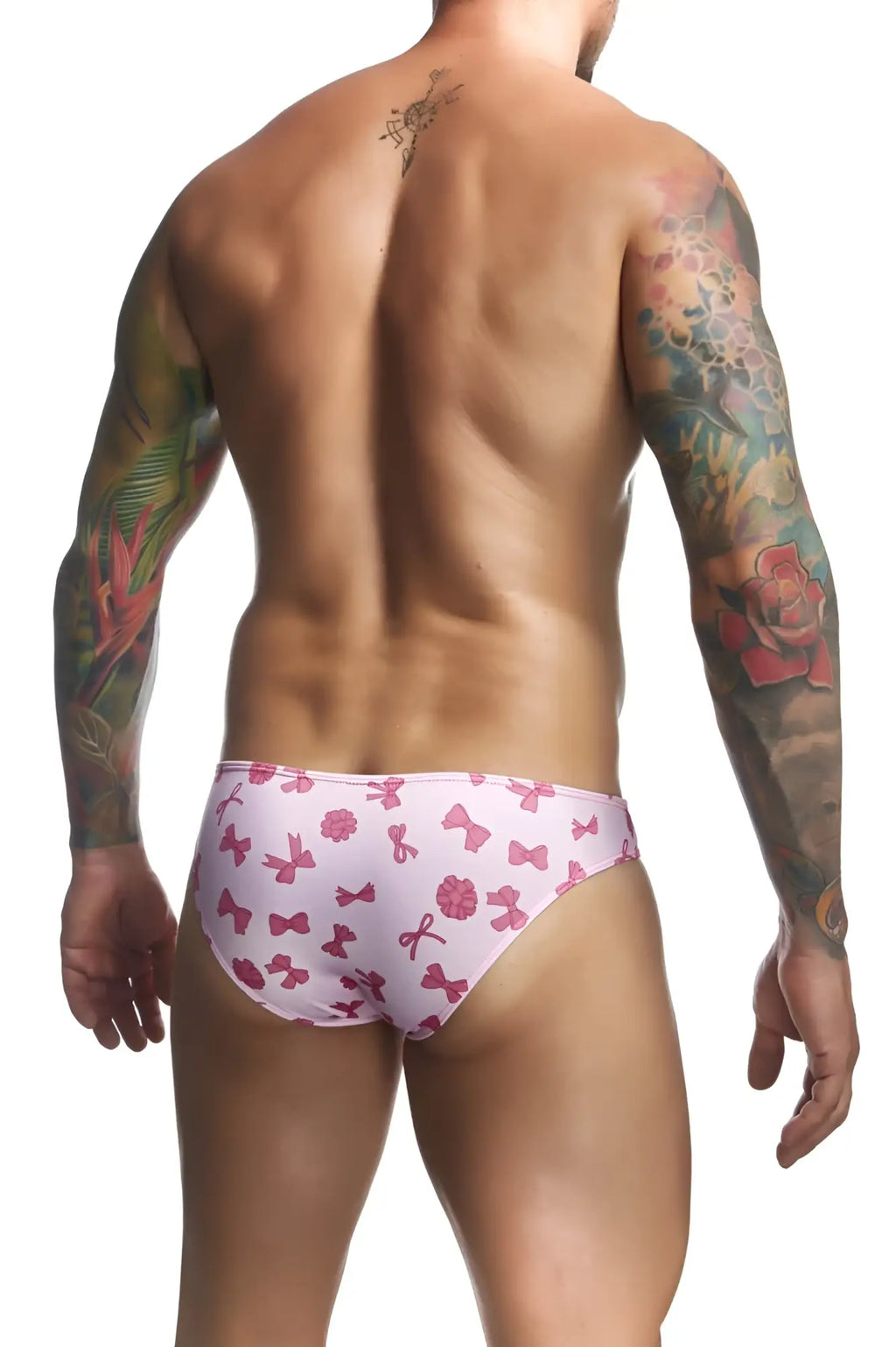 Pink bow-patterned men’s swim trunks from justin simon xsj01 classic bikini color coquette collection