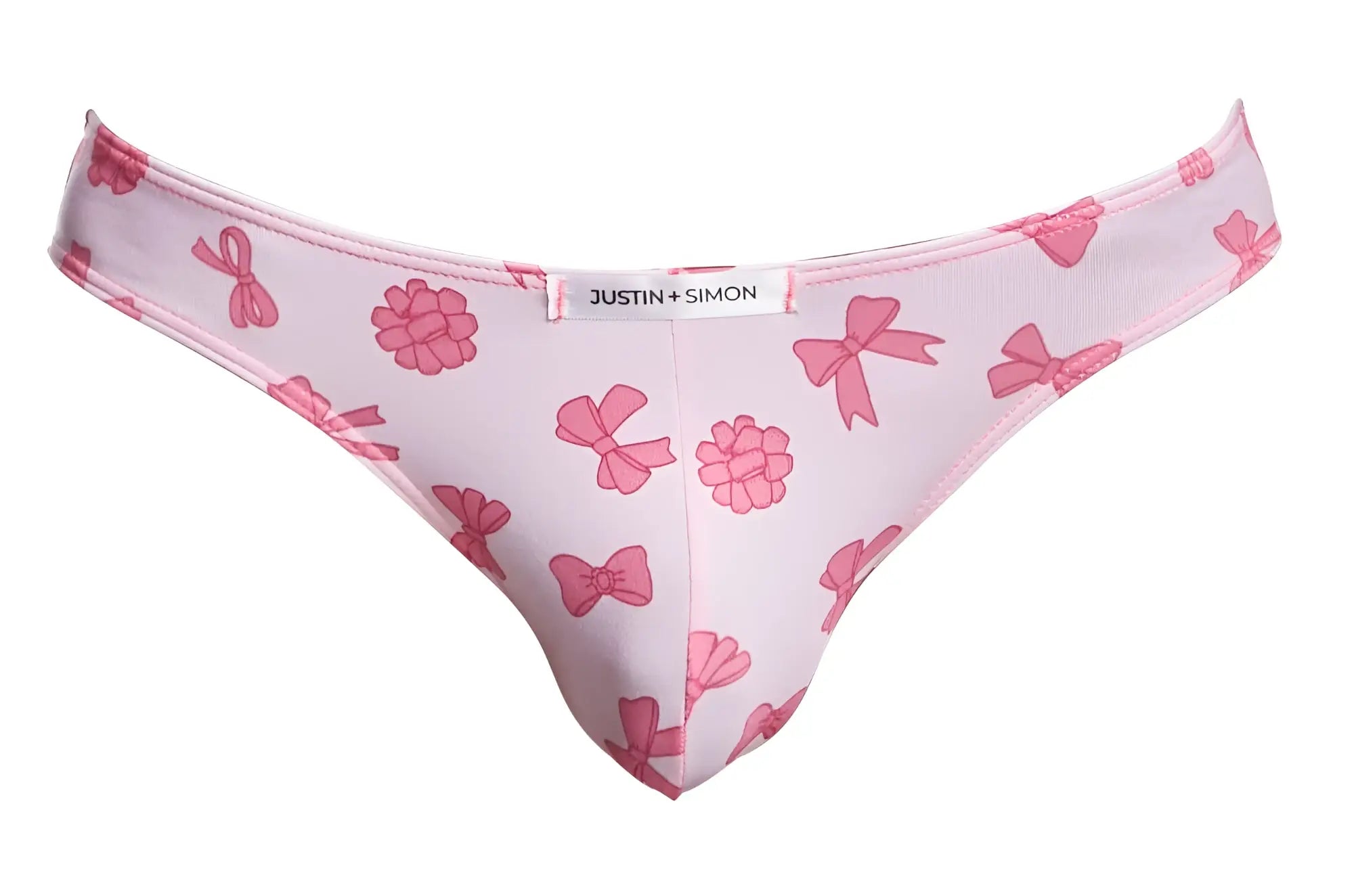 Pink patterned thong with raspberry design and bow featuring white justin simon label from classic bikini color coquette collection