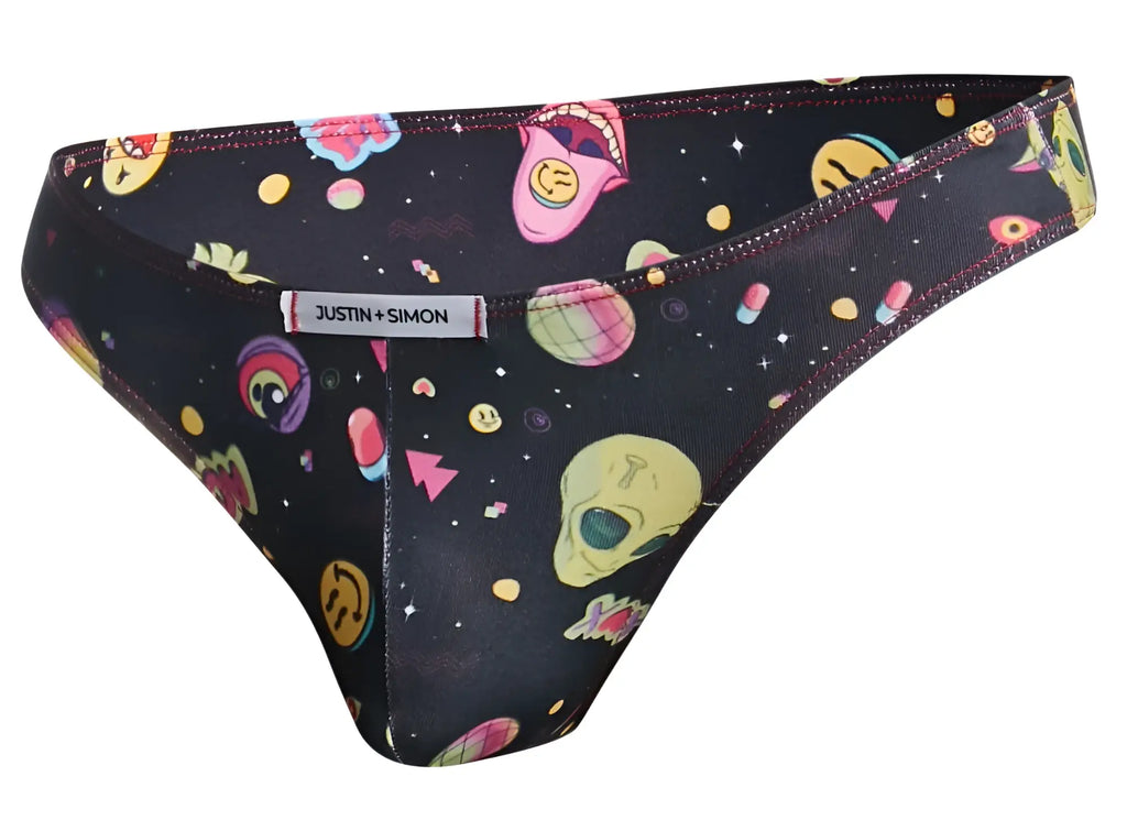 Black justin simon thong with vibrant cosmic pattern featuring colorful alien faces skulls and space graphics