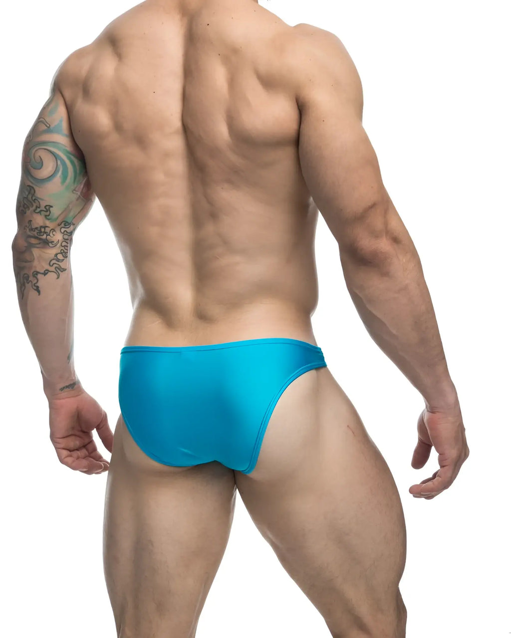 Bright turquoise justin simon xsj01 classic bikini swim trunks with a sleek form-fitting design for swimming