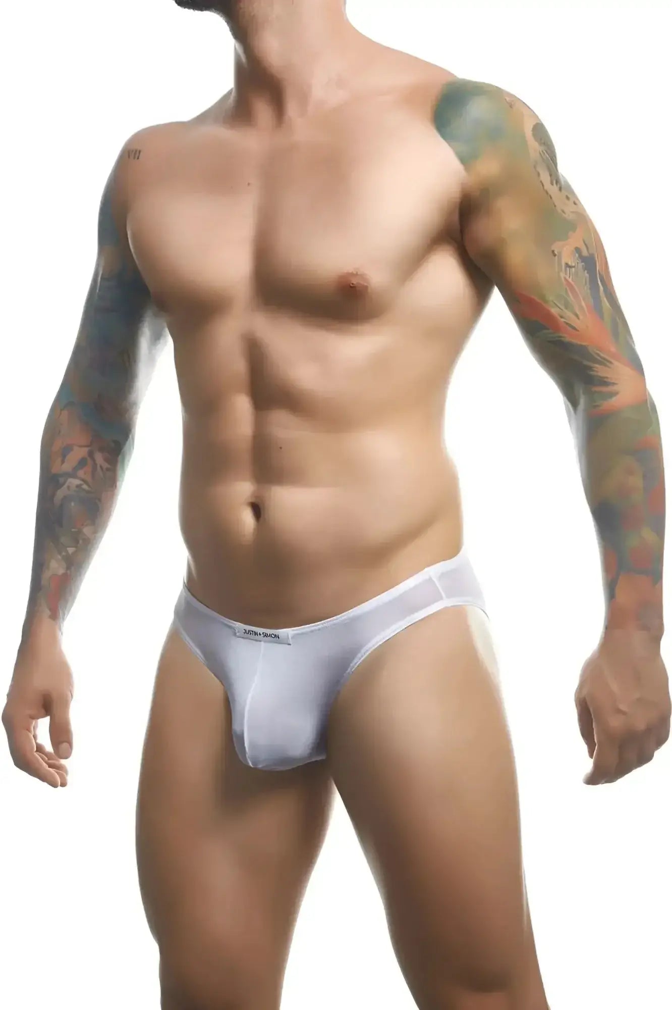 White form-fitting men’s briefs in mesh with a subtle justin simon logo on the waistband classic bikini style