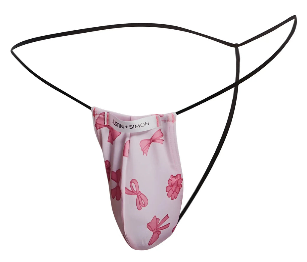 Pink bow-patterned justin and simon coquette classic g-string thong with black elastic straps shown from the back side