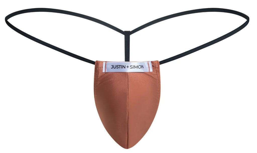 A tan ochre justin simon classic g-string thong with smooth texture and black elastic straps