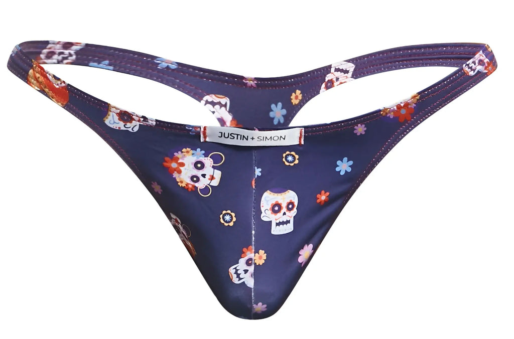 Dark blue classic thong with sugar skull and floral pattern showing back side and justin simon brand label