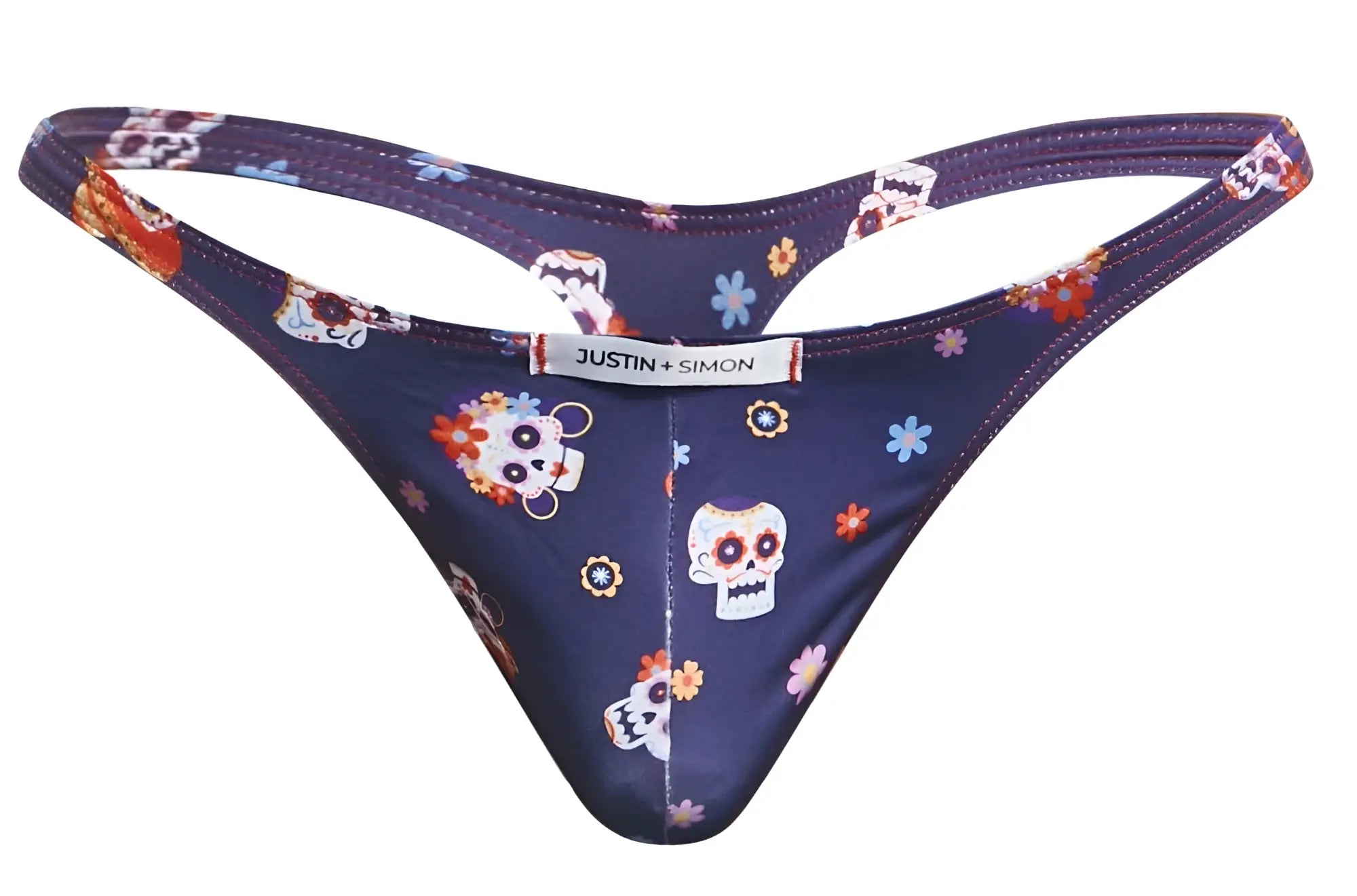 Dark blue classic thong with sugar skull and floral pattern showing back side and justin simon brand label