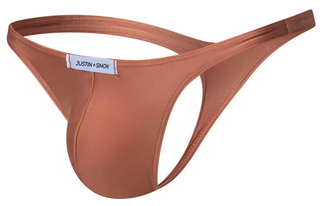 A sleek rust-colored JUSTIN+SIMON XSJ03 classic thong made of smooth stretchy fabric with a minimalist branded label