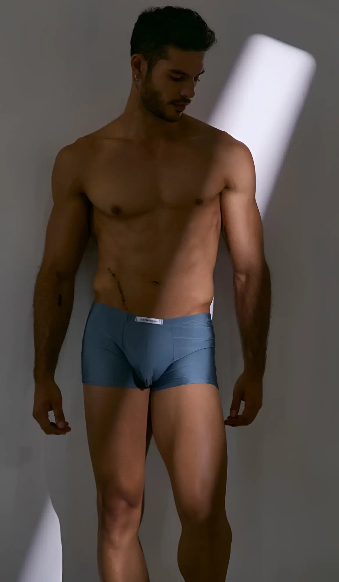 Blue cotton briefs with a white waistband label from justin simon xsj08 classic boxer color metal green collection