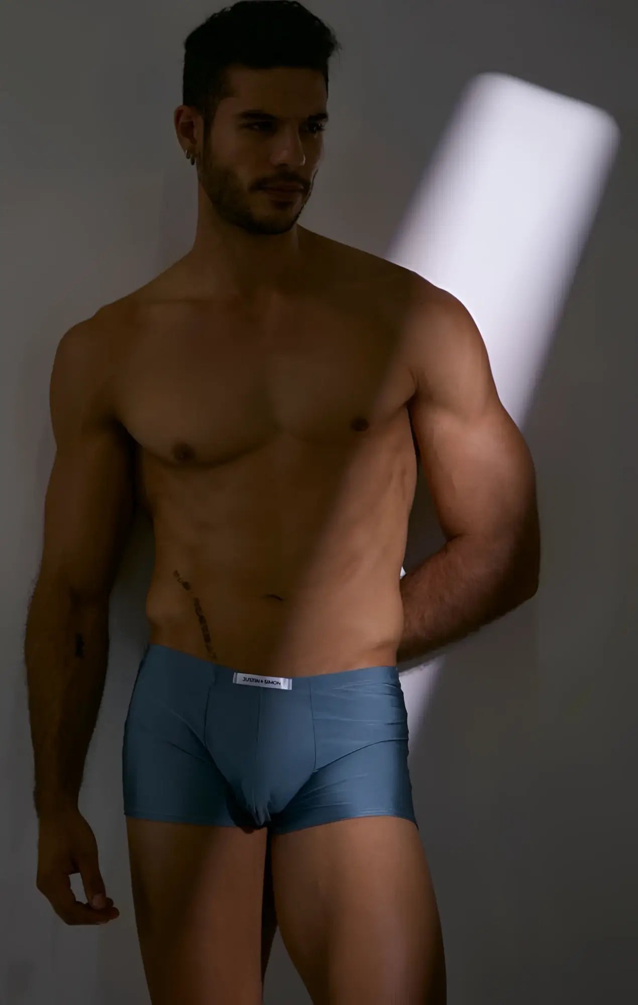 Blue men’s boxer briefs with white waistband and justin simon label classic metal green color