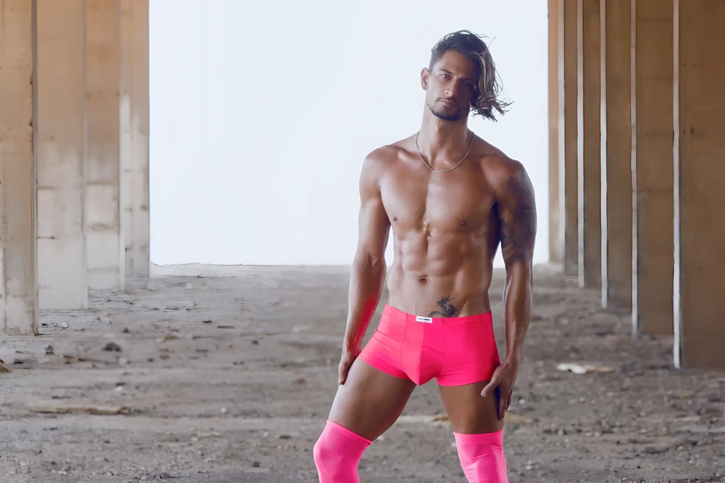 Bright pink JUSTIN+SIMON XSJ08 classic athletic briefs with a white brand tag at the waistband in coral color