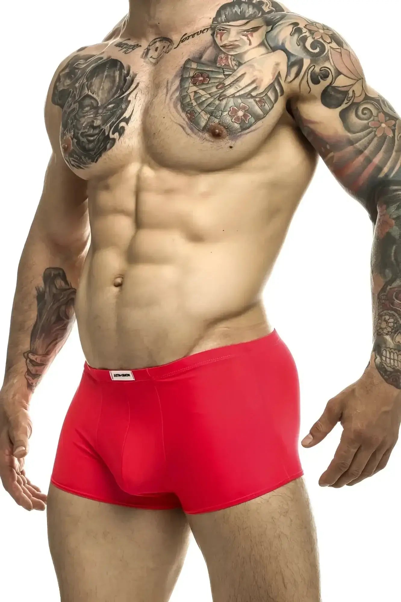 Red coral justin+simon classic trunks with a small white brand tag on the waistband in briefs style