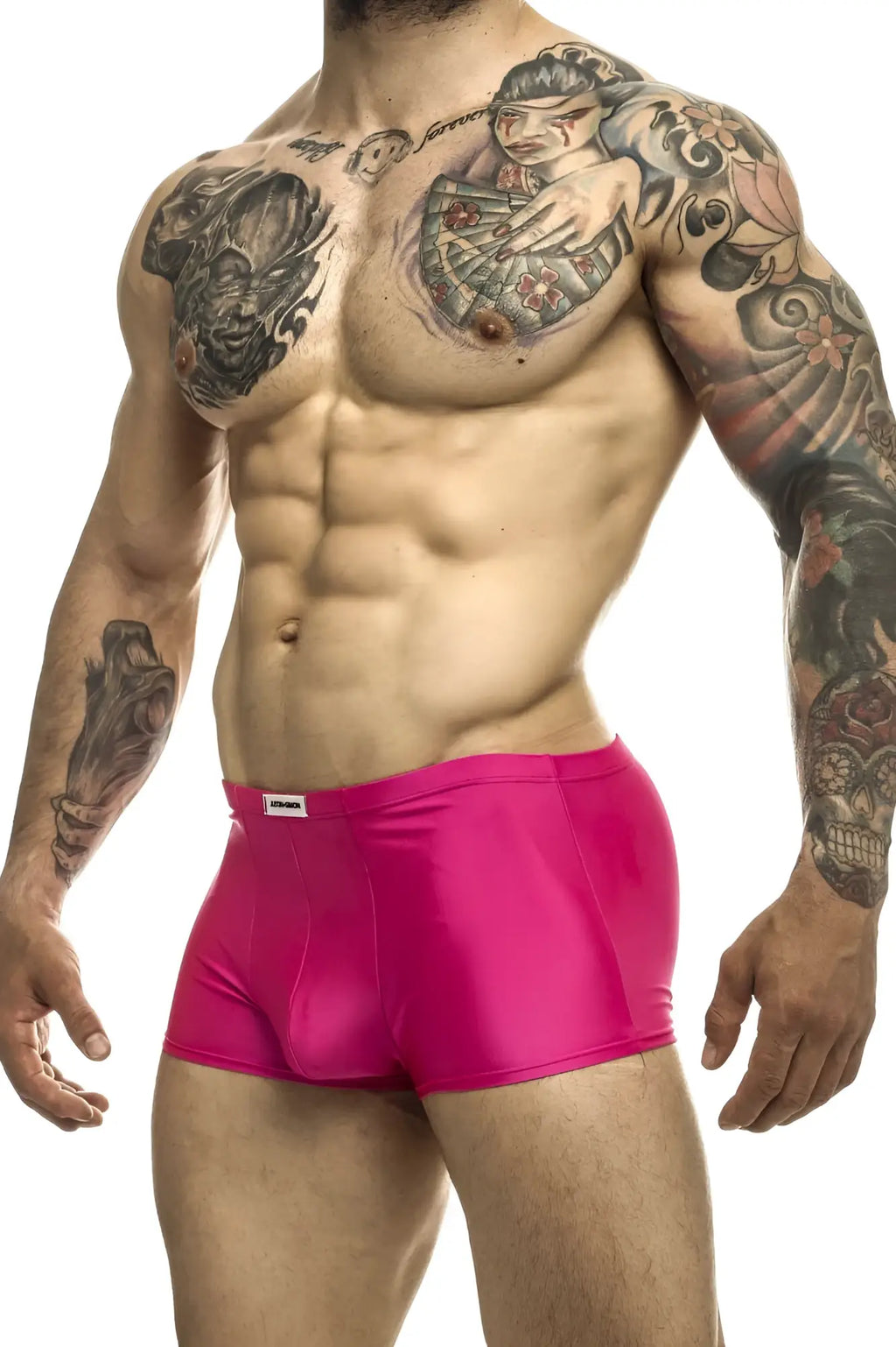 Bright pink shiny fabric briefs with a white brand tag on the waistband from justin simon xsj08 classic trunks collection
