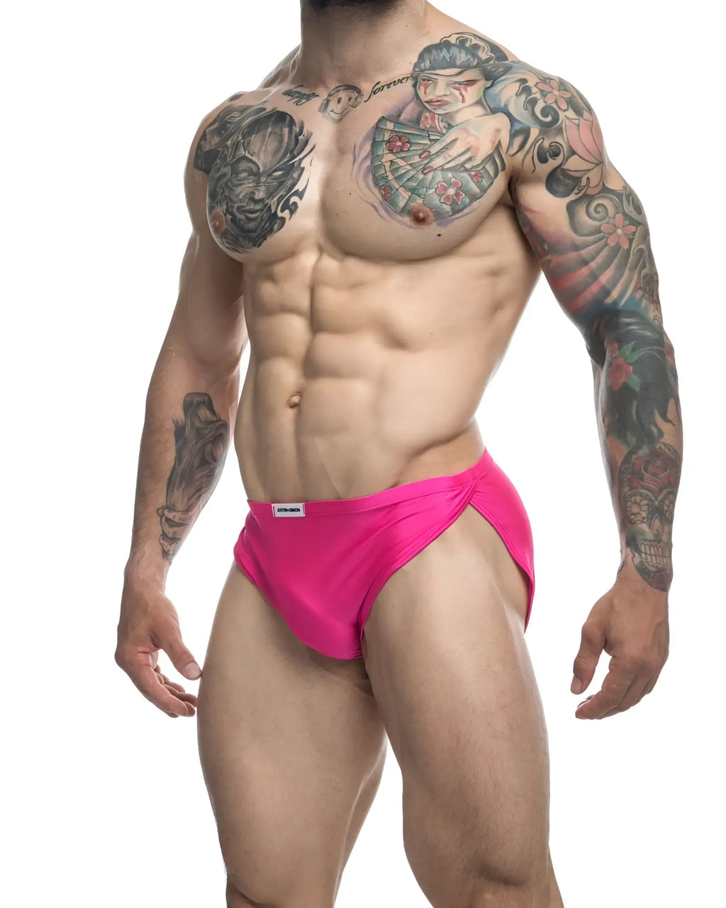 Bright pink justin simon xsj09 running shorts with snug fit and small white label at waistband for athletic use