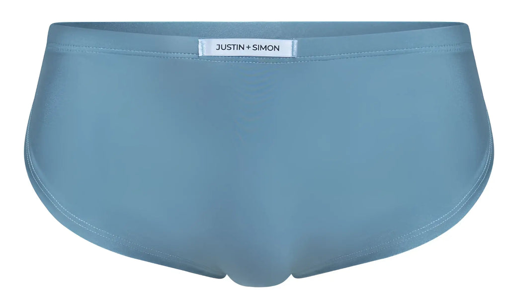 Light blue justin + simon briefs with smooth seamless fabric finish shown with xsj09 metal green running shorts