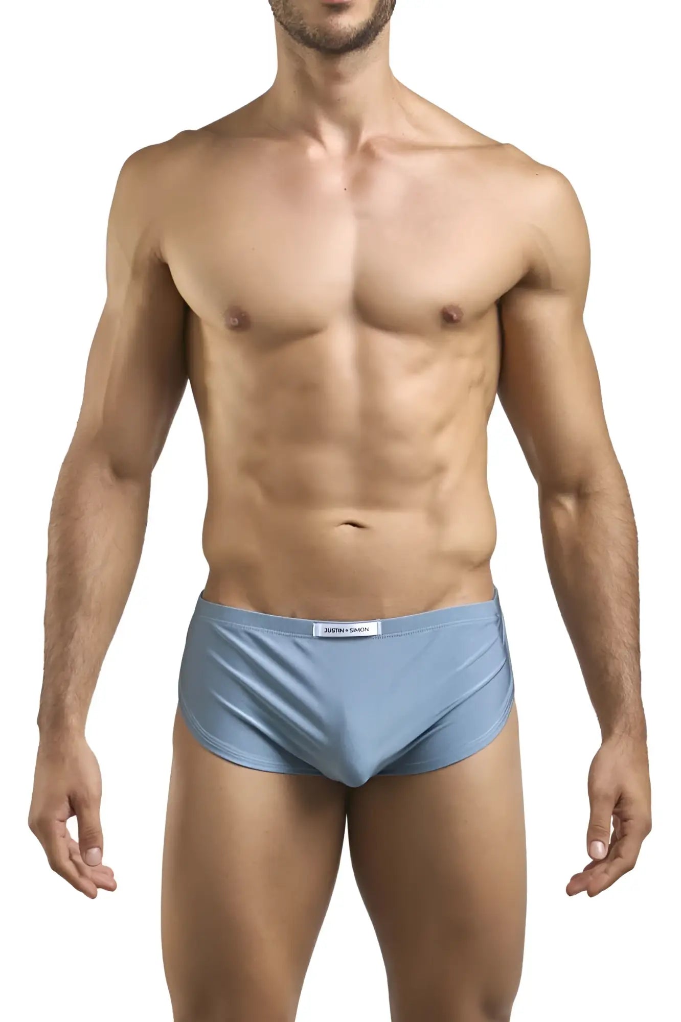 Light blue satin briefs with subtle brand tag paired with justin simon xsj09 metal green running shorts