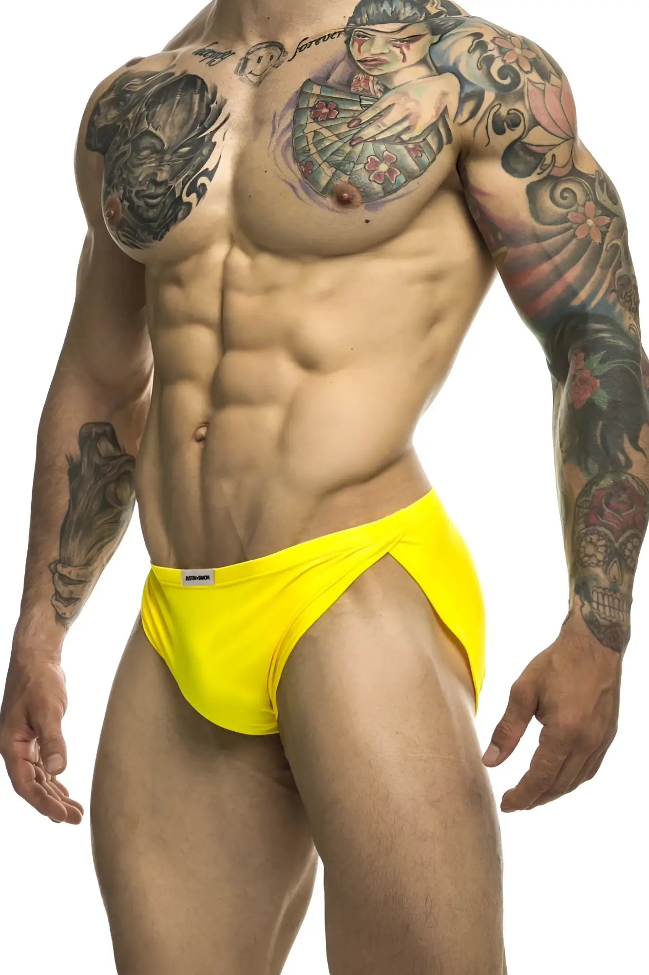 Bright yellow justin simon xsj09 running briefs with a small white brand tag on the waistband for athletic use