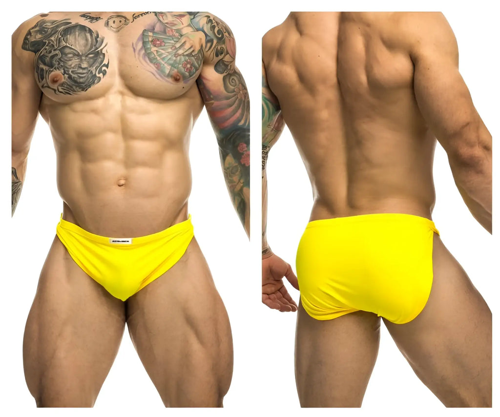 Bright yellow justin simon xsj09 running shorts with snug fit and small white brand tag at waistband
