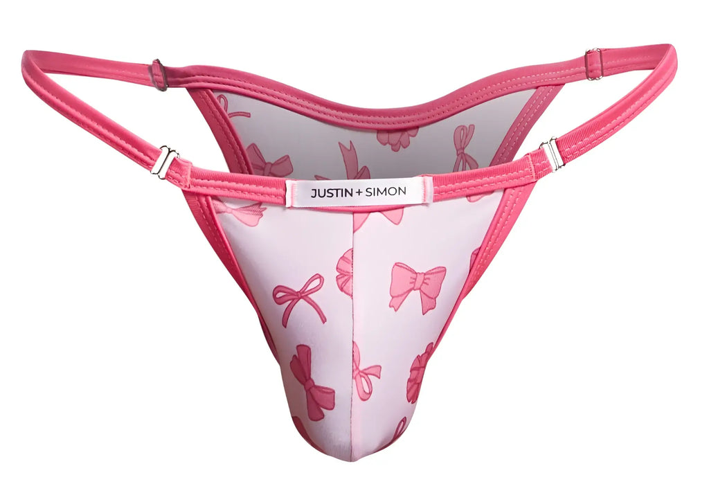 Pink bow-patterned thong bikini by justin + simon in coquette color for stylish swimwear look