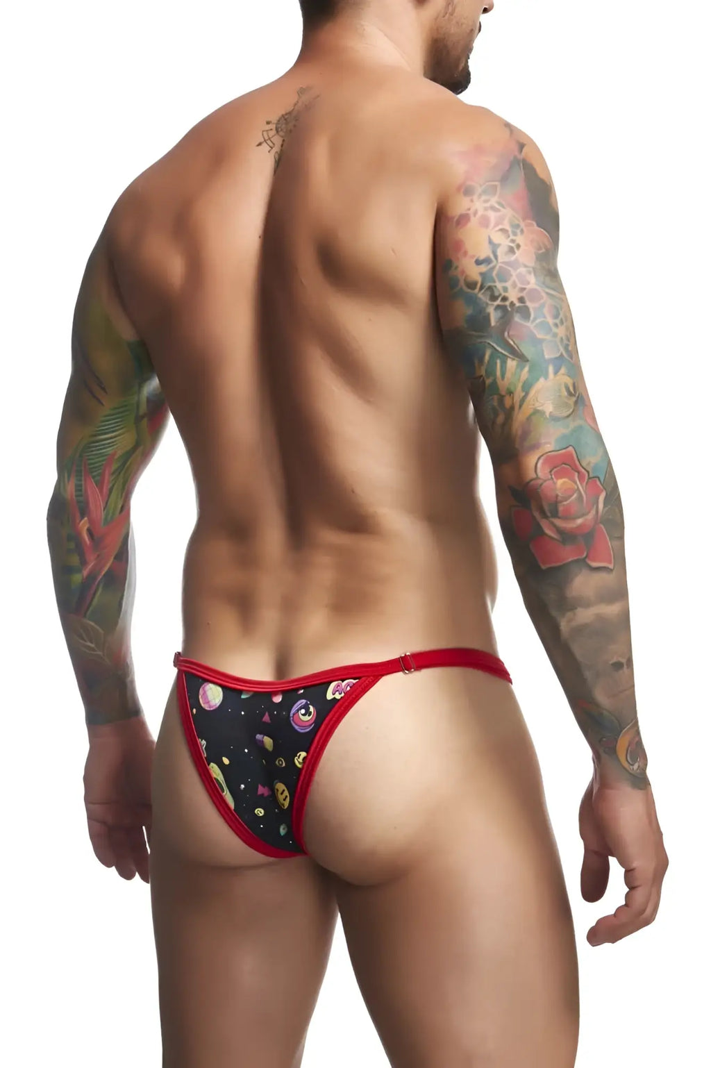 Black thong with red trim and a cosmic pattern featuring planets stars and cartoon faces from Justin Simon XSJ12 Bikini Psycodelic