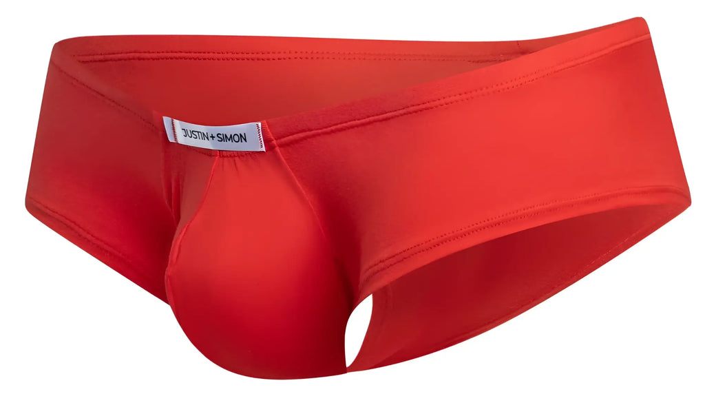 Bright red justin simon cheeky bulge boxer with prominent pouch and white brand label in form-fitting style