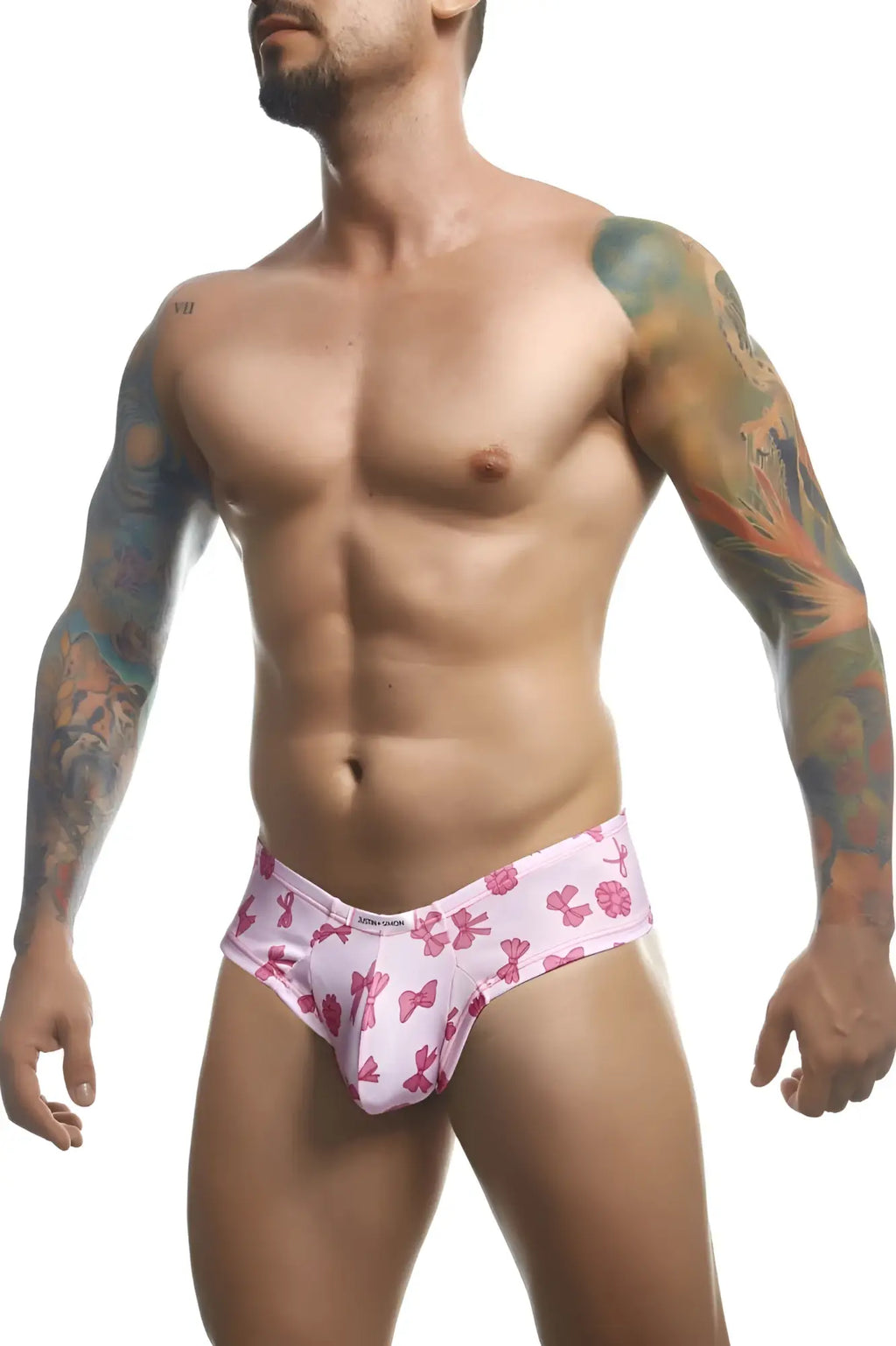 Justin simon xsj22 cheek briefs in coquette color featuring pink bow-patterned men’s stretch fabric front view