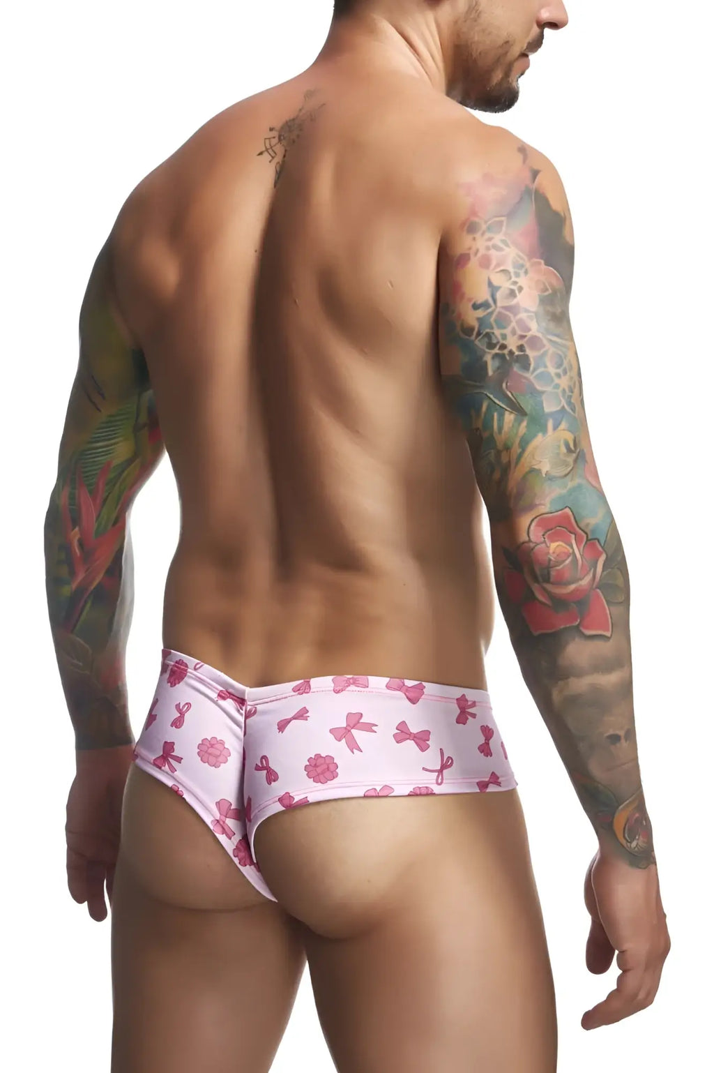 Pink patterned swim trunks with playful bows and flowers design from justin simon xsj22 cheek briefs color coquette collection