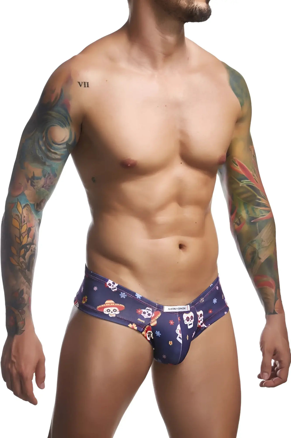 Dark blue Calvin Klein cheek briefs with colorful skulls wearing hats and festive decorations in Mexico colorway
