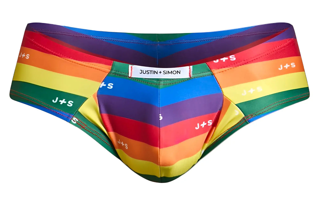 Rainbow-striped men’s briefs by justin simon with bold diagonal pride colors and repeating j+s branding in cheek brief style