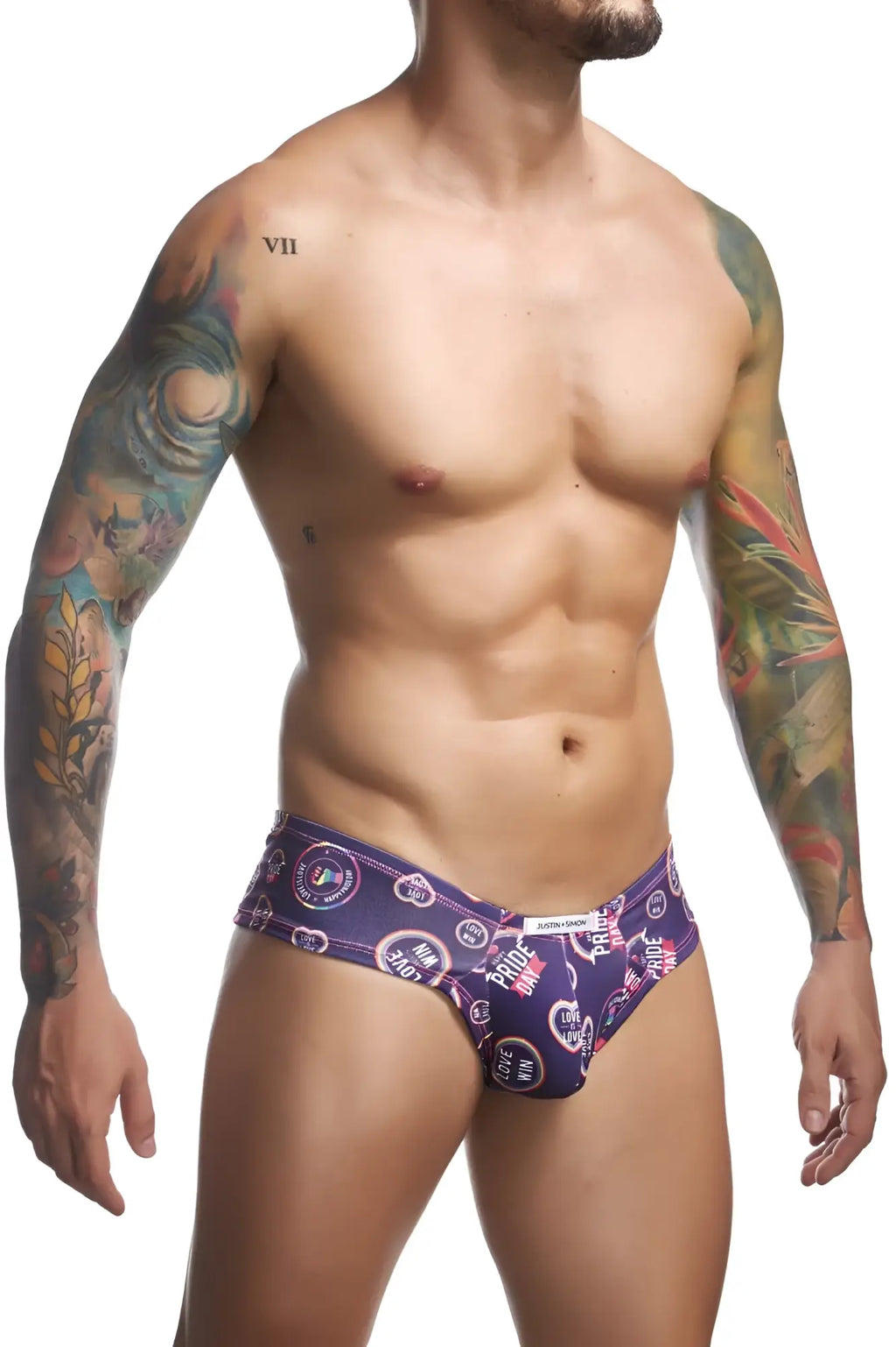 Purple patterned men’s briefs with circular pride motifs and heart symbols from justin+simon cheek briefs color pride