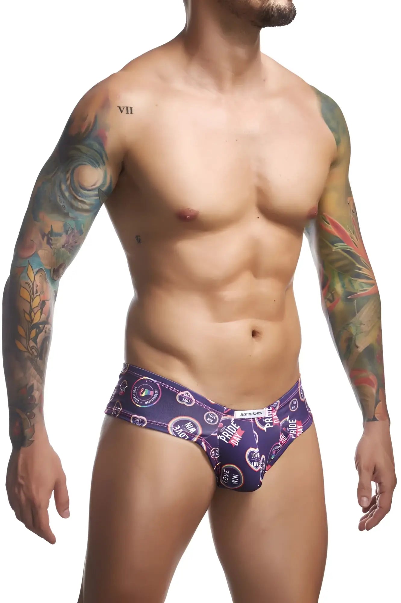 Purple patterned men’s briefs with circular pride motifs and heart symbols from justin+simon cheek briefs color pride