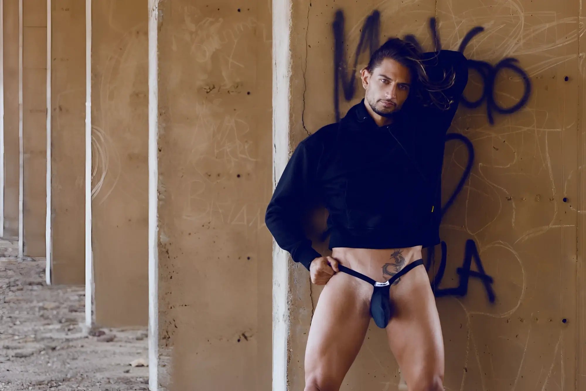 Black leather JUSTIN SIMON bulge thong with small silver buckle at front in opal green color
