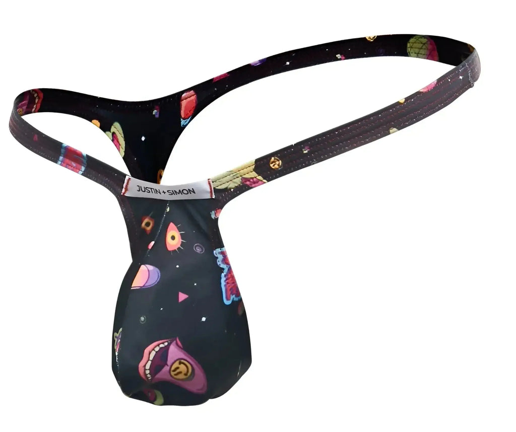 Black justin simon bulge thong with vibrant cosmic design featuring colorful planets stars and cartoon alien faces