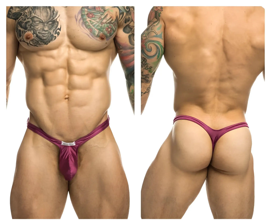 A vibrant wine magenta satin JUSTIN+SIMON bulge thong with a sleek form-fitting design and front metallic clasp