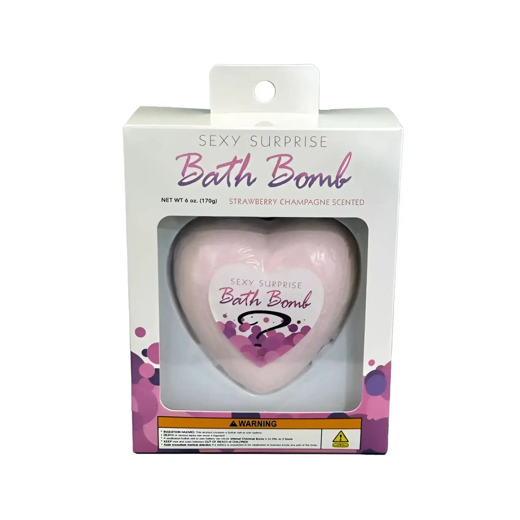 Kheper Games sexy surprise bath bomb is a pink heart-shaped bath bomb in a clear plastic box with a white label