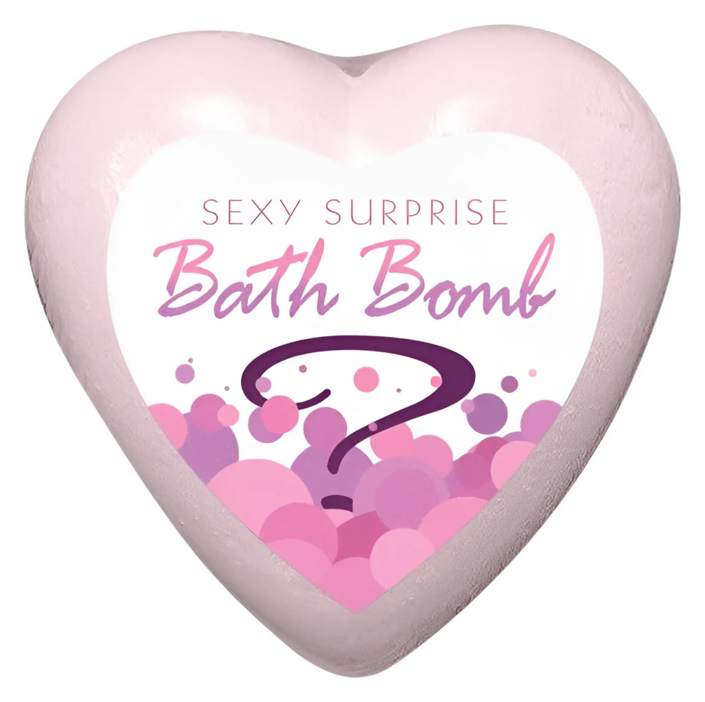 Kheper Games sexy surprise bath bomb is a pink heart shaped bath bomb with a white label and purple bubbles