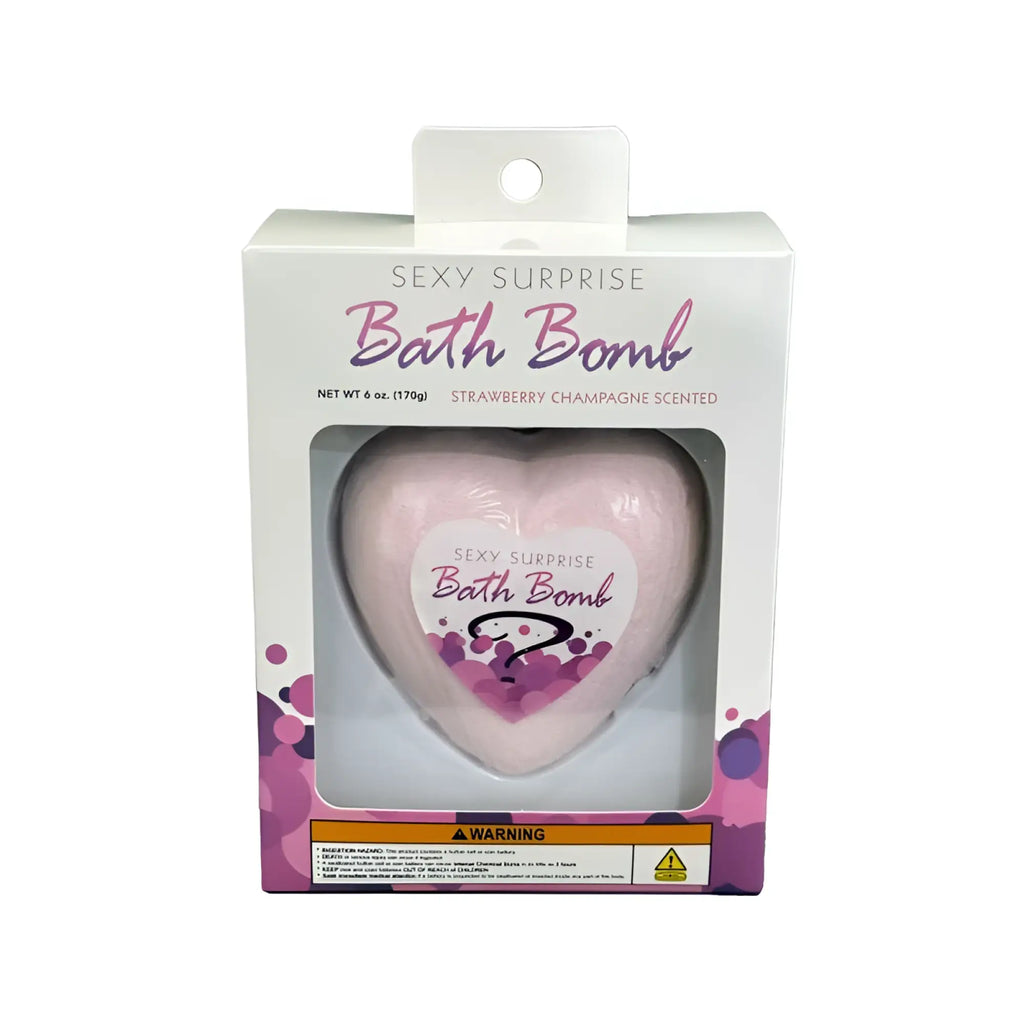 Kheper Games sexy surprise bath bomb is a pink heart-shaped bath bomb in a clear plastic box with a white label