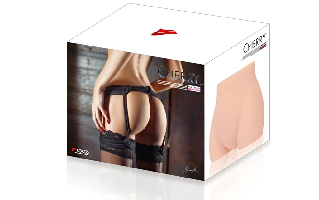Cherry brand silicone butt plug with black lace trim shown from the back side in kokos real hip cherry design